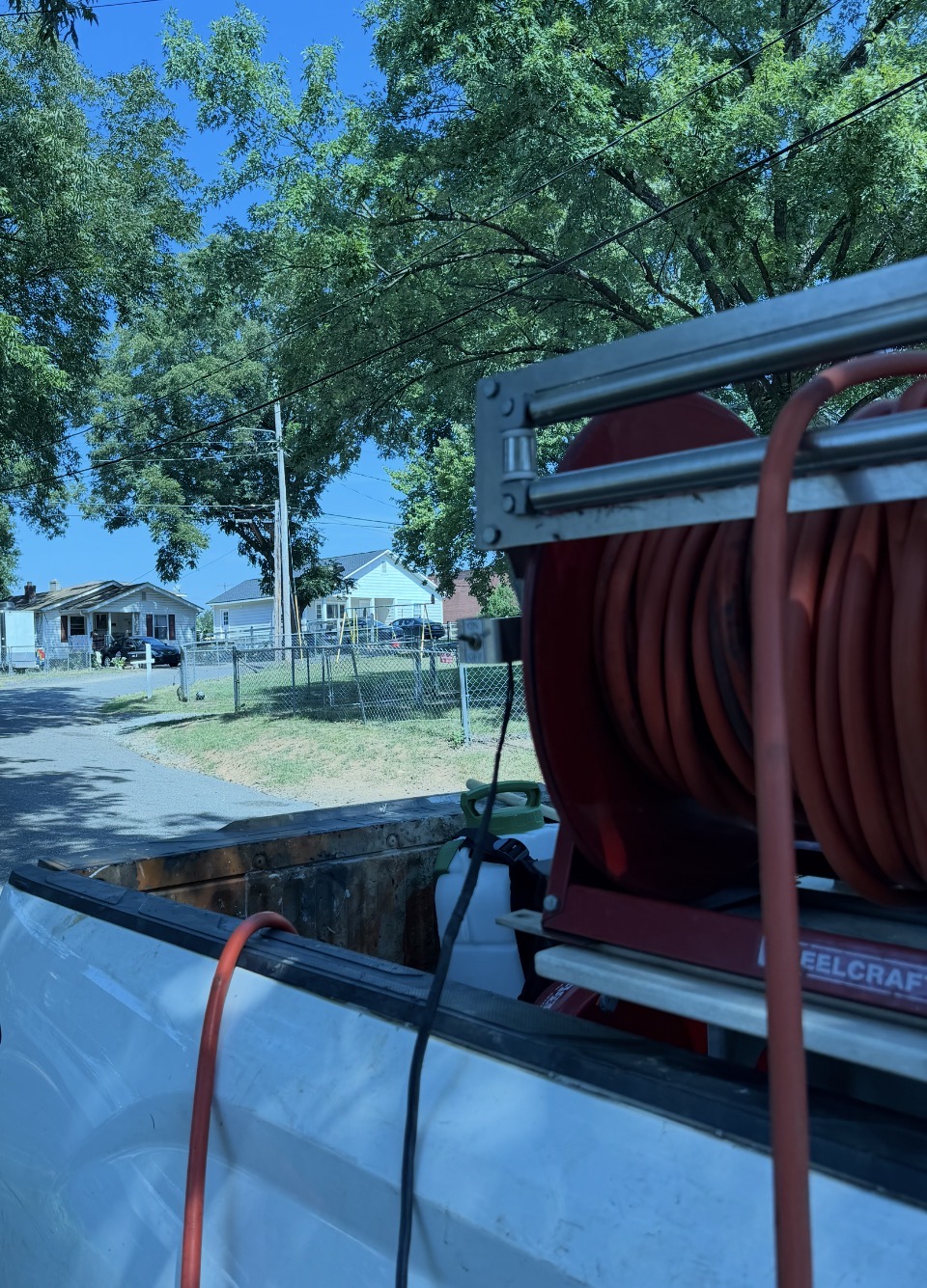 Flint Mill village mill house in Gastonia NC seen from the Envirosafe truck with the hose reel in the foreground