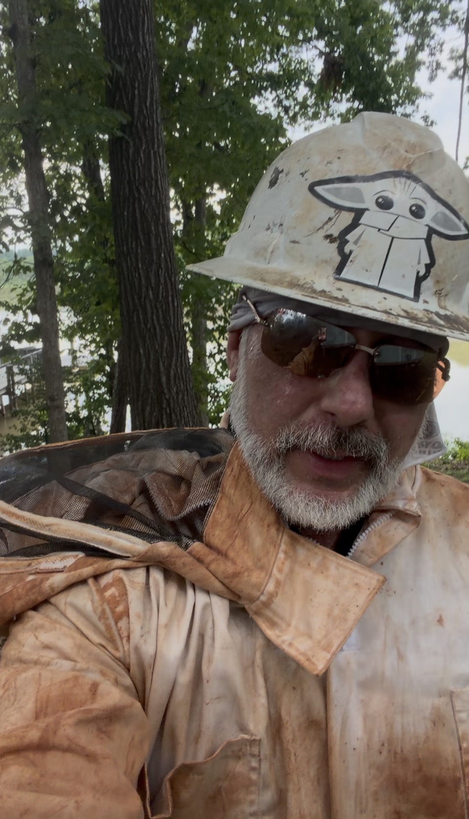 Rodney Allman of Envirosafe in a bee suit at Mountain Island Lake