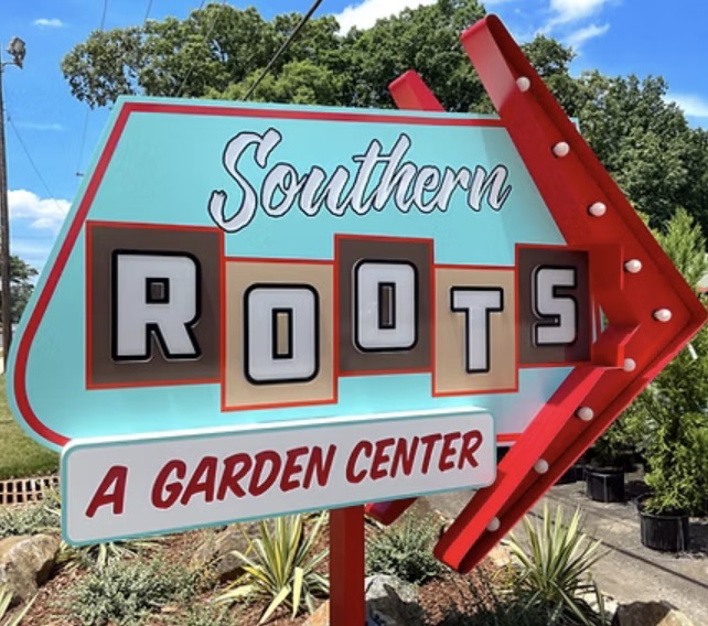 Retro turquoise and red arrow sign for Southern Roots, A Garden Center, in the Catawba Heights neighborhood of Belmont NC